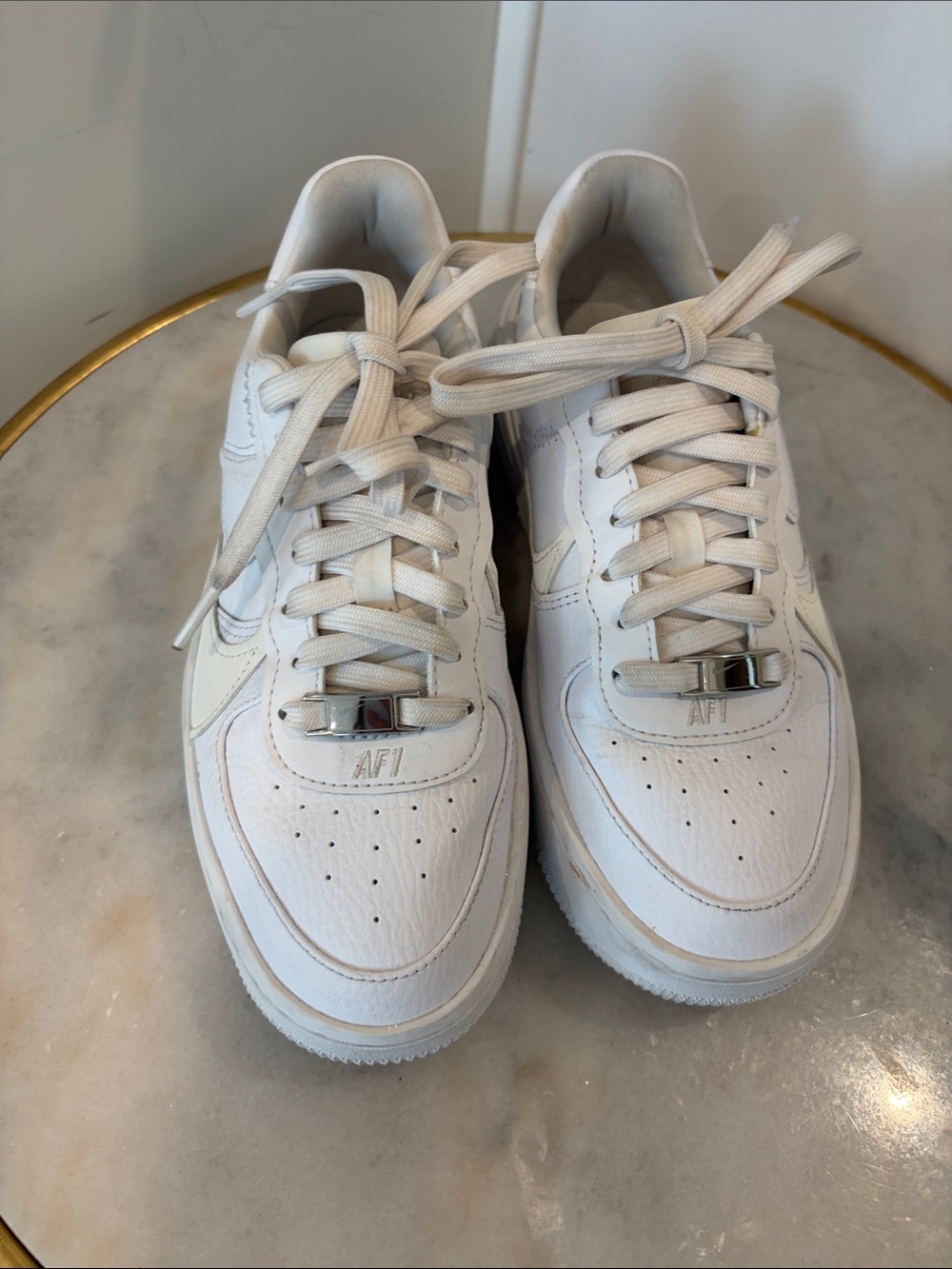 Nike White Low-Top Leather Sneakers with Metallic Accents